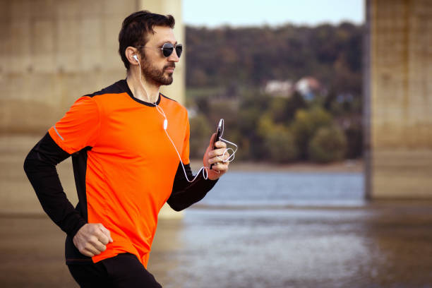 istock jogging with earphones 1095010828