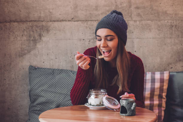 istock Happy woman eating healthy breakfast 1095011790