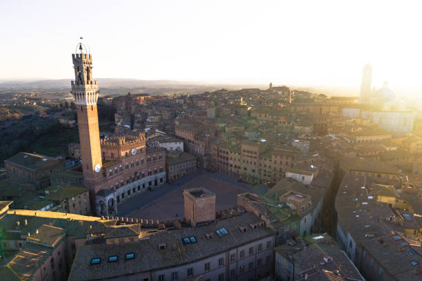 Siena - Aerial View of Piazza del Campo Piazza del Campo at Sunset - Jan 2018 - Aerial View torre del mangia stock pictures, royalty-free photos & images