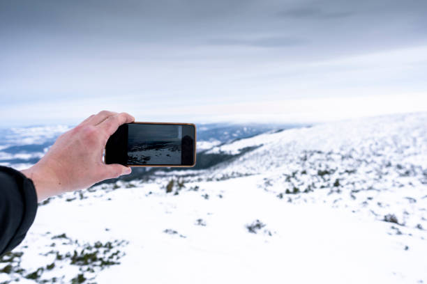 istock Photographing a snowy landscape 1095012512