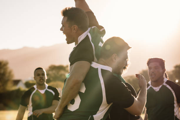 istock Excited rugby players celebrating a win 1095014260