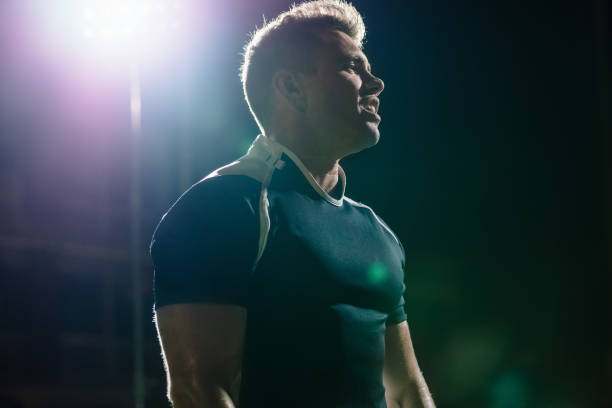 Rugby player on field under lights