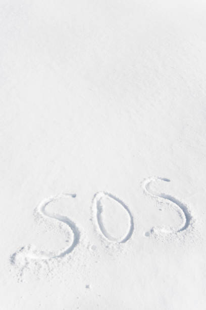 istock sos written in the snow 1095014468