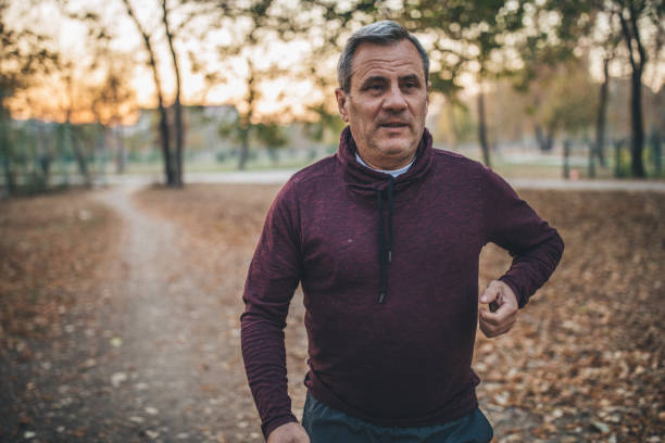 istock Man running at the park 1095014998