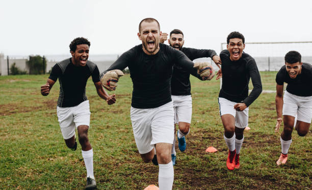 istock Soccer players screaming in joy after victory 1095015704