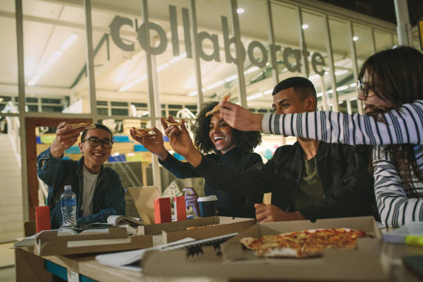 istock Students hanging out at university campus cafe 1095019620