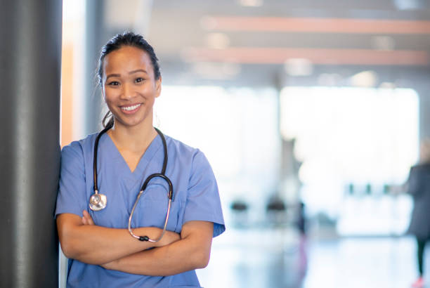 istock Smiling asian doctor 1095022446