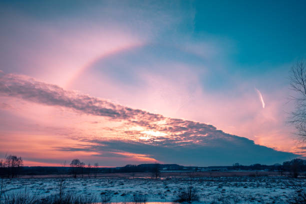 istock Winter snowy scenery. Snow covered field at sunset 1095023242