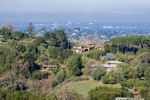 View towards the houses built in Los Altos hills, Mountain View and the San Francisco bay shoreline in the background, California