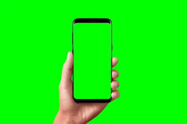 Modern phone in hand isolated. Chroma key for video mockup presentation.