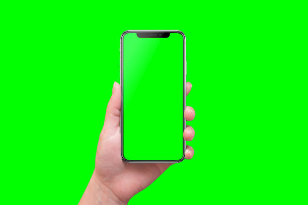 Modern smart phone in hand close-up. Isolated screen and background in green. Modern smart phone in hand close-up. Isolated screen and background in green. chroma key stock pictures, royalty-free photos & images