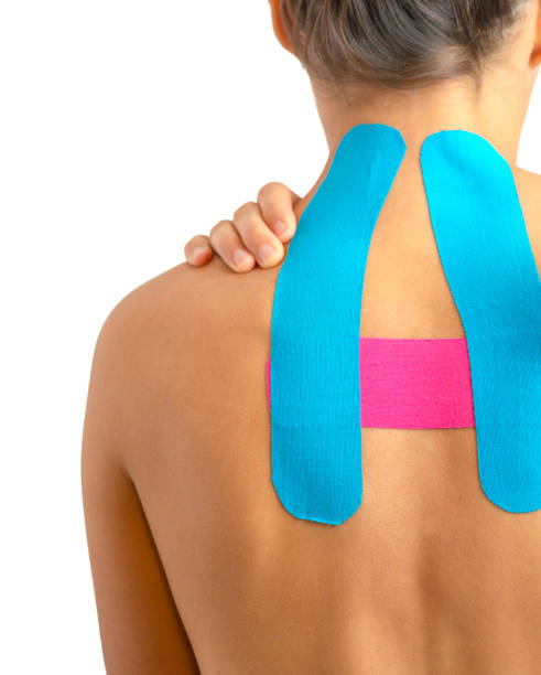 istock Female back with kinesio tape on white background 1095040196