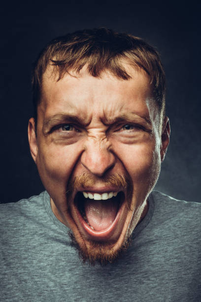 istock Creative male portrait. Young handsome man is screaming. Radical expression and emotion concept 1095040222