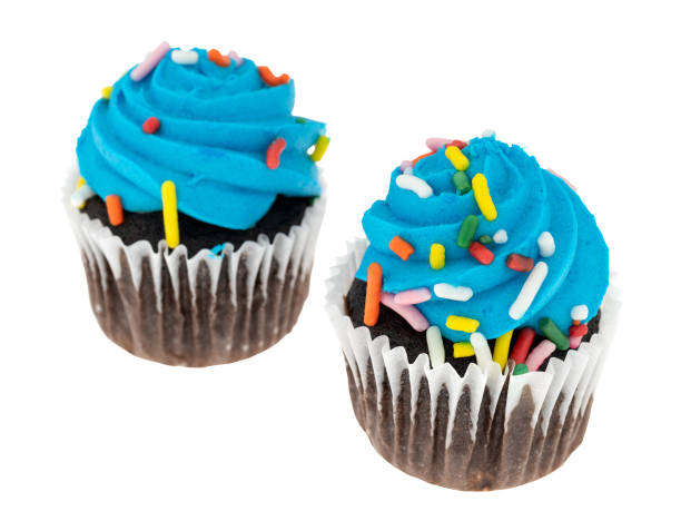 istock Two blue frosted chocolate cupcakes isolated on a white background. 1095040602