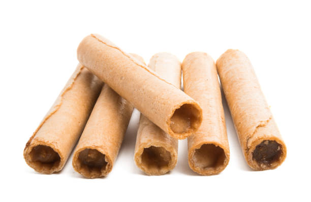 istock waffle rolls with cream isolated 1095040750