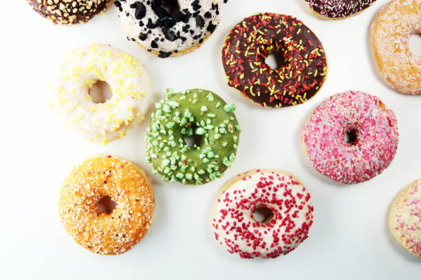 istock assorted donuts with chocolate frosted, pink glazed and sprinkles 1095046338
