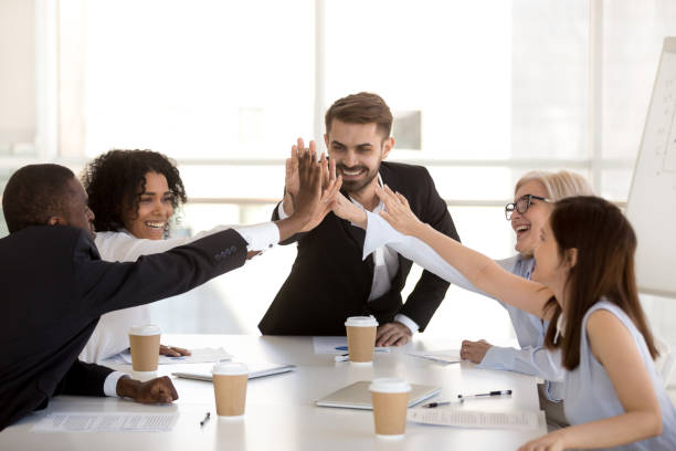 istock Happy motivated diverse business team people giving high five 1095047030
