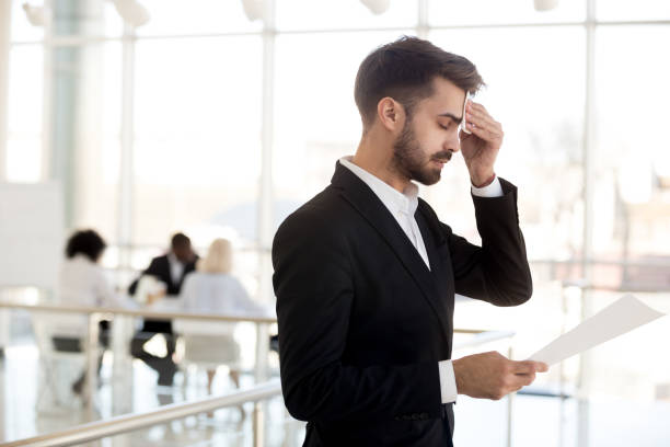istock Sweaty nervous businessman wiping forehead afraid before public speaking 1095047078