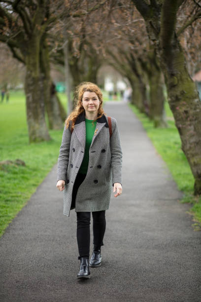 istock Smiling Woman Walking Towards Camera 1095047376