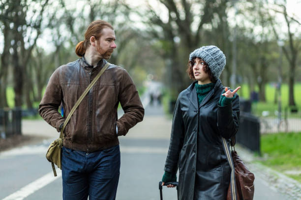 istock Tourist Couple Walking Through Park in Edinburgh 1095047504