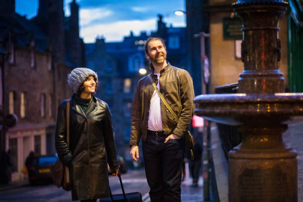 istock Smiling Couple Walking Through Edinburgh at Night 1095047532