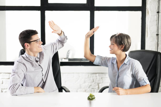 istock Young happy colleagues sitting in the office 1095049856