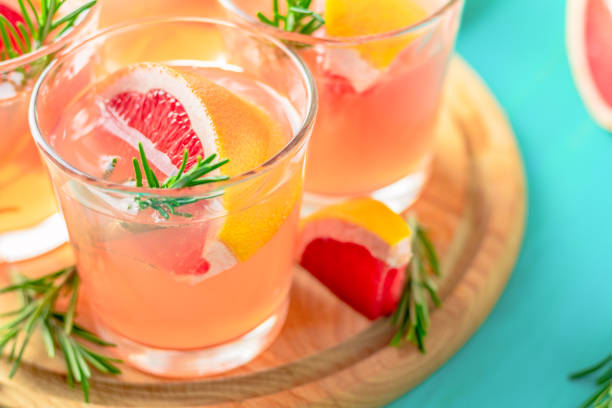 istock Pink alcoholic cocktail with grapefruit, ice and mint 1095052452