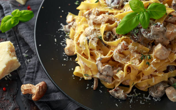 istock Pasta with shiitake mushrooms and chicken with herbs and cheese 1095055322