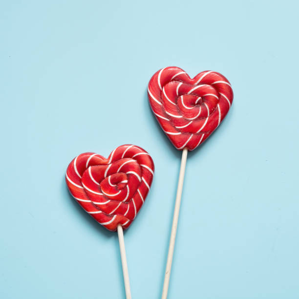 istock Valentine's card. Lollipops candy as heart on blue. Funny concept. 1095062638