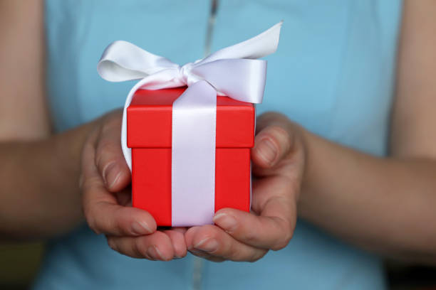 istock Woman with gift box in her hands 1095065722
