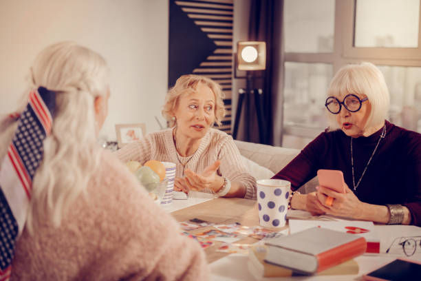 istock Nice aged women sitting around the table 1095066250