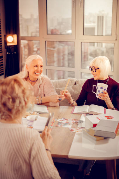istock Delighted cheerful aged woman taking a cookie 1095066286