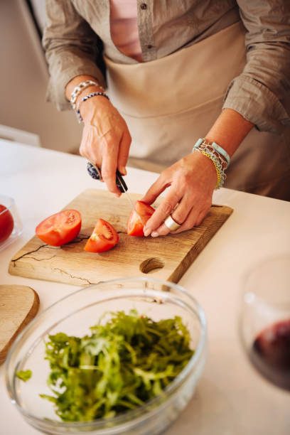 istock Close up of tomatoes lying on the cutting board 1095066298