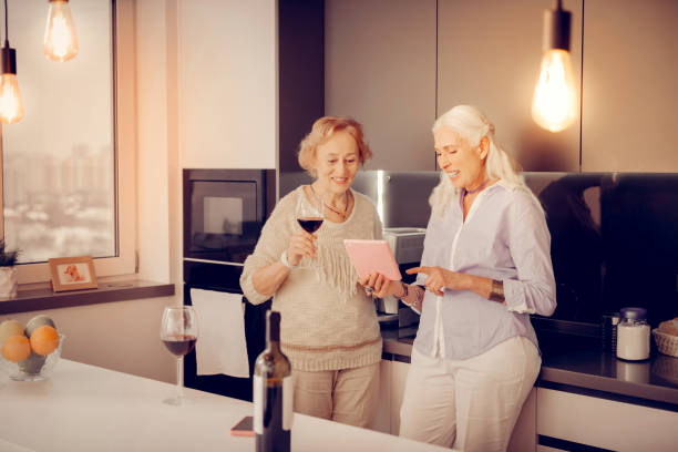 istock Pleasant senior woman holding a new tablet 1095066650