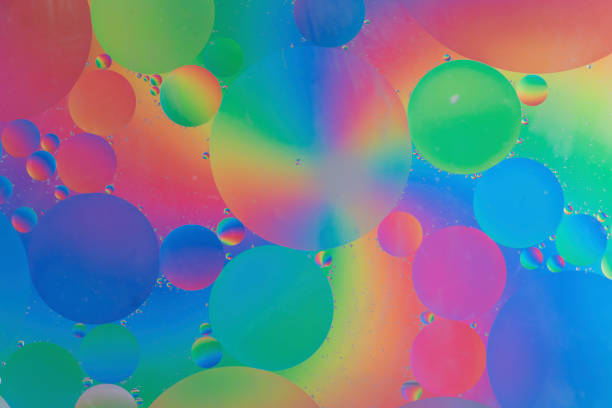 istock Oil drops in water macro with a colourful background 1095066902