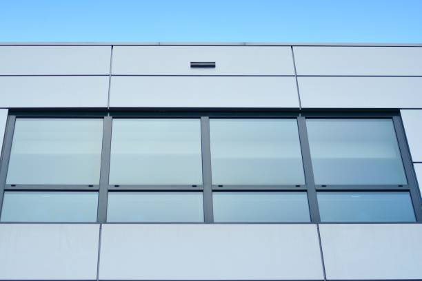 istock Modern building with reflected sky and cloud in glass window 1095068522