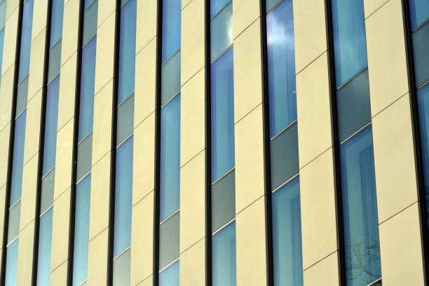 istock Modern building with reflected sky and cloud in glass window 1095071590