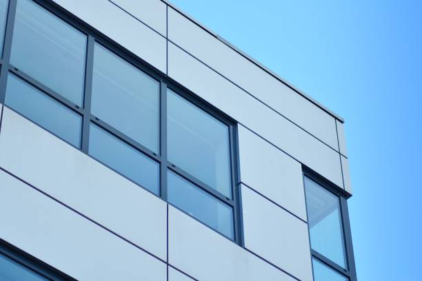 istock Modern building with reflected sky and cloud in glass window 1095072016