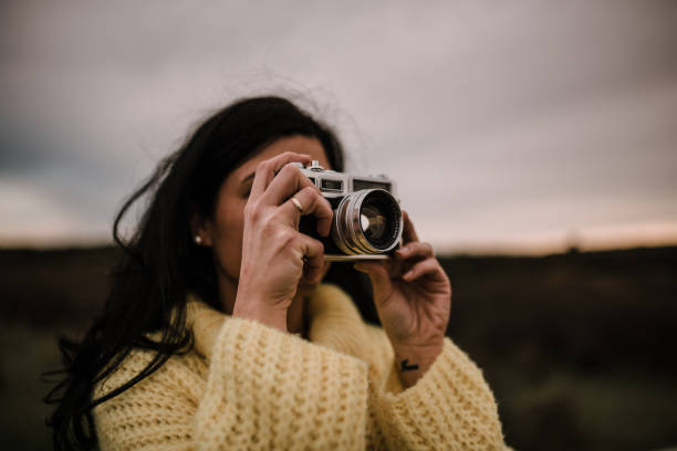 istock Woman with vintage camera 1095073514