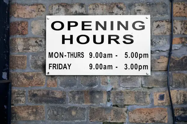 Opening hours shop sign Monday to Friday daytime uk