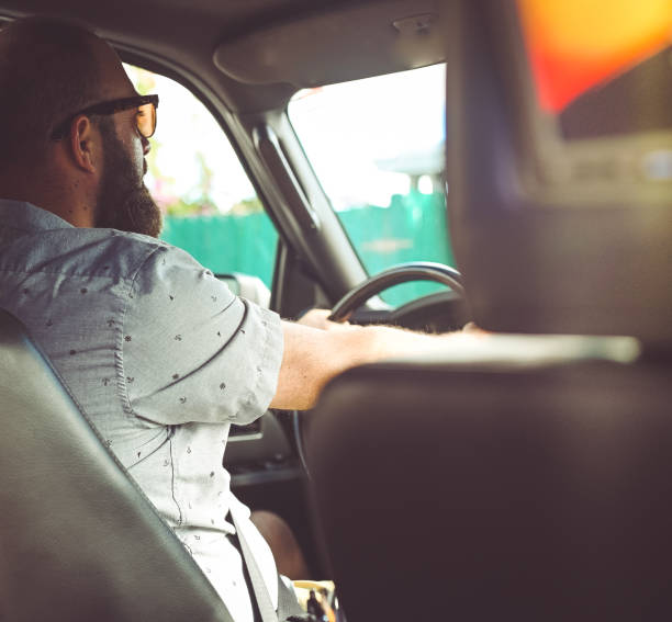 istock Man driving a vehicle, cheerful candid image 1095077508
