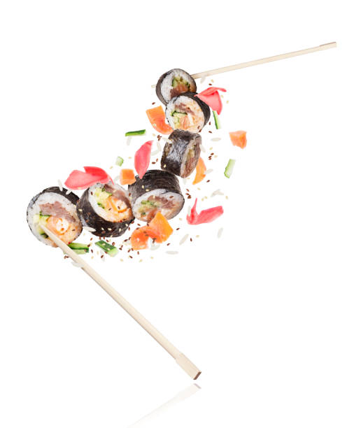 istock Fresh sushi rolls with salmon pieces on white background 1095081084