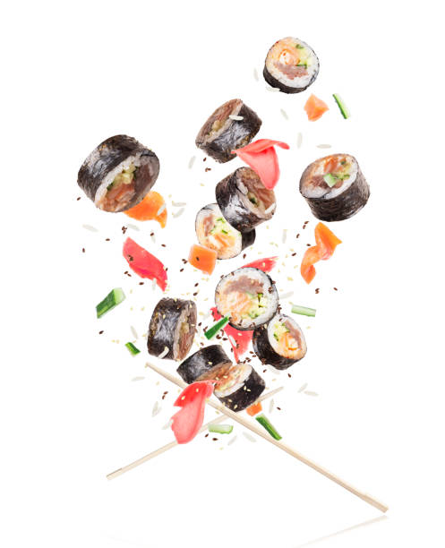 istock Sushi with chopsticks chaotically hovering in the air on white background 1095081106