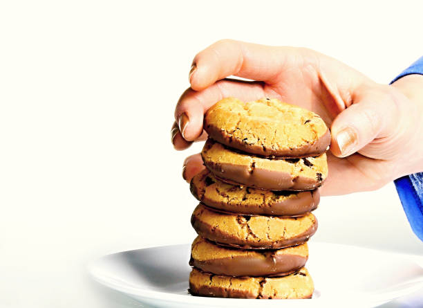 istock chocolate cookies with hand gesture 1095081136