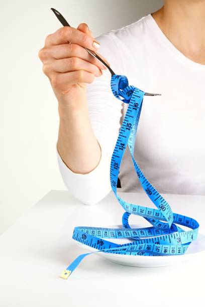 istock Tape measure and plate 1095081230