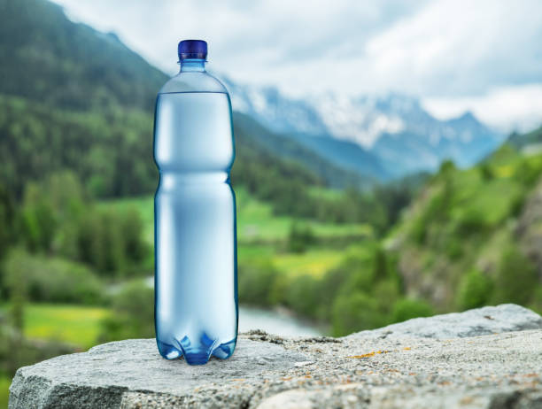istock Bottle of water on the stone. 1095083026