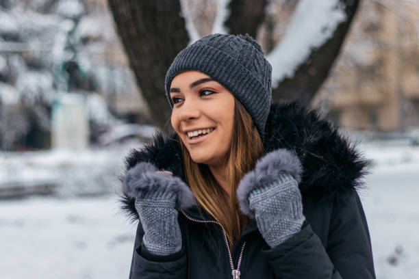 istock Smiling woman in winter clothes 1095087664