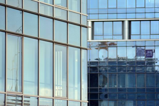 istock Modern building with reflected sky and cloud in glass window 1095087680