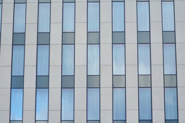 istock Modern building with reflected sky and cloud in glass window 1095089006