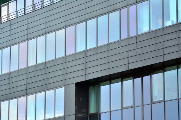 istock Modern building with reflected sky and cloud in glass window 1095092072